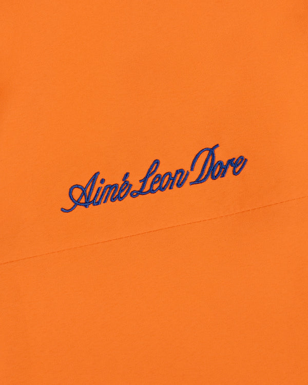 Orange Mets GORE-TEX Rain Delay Jacket with Aimé Leon Dore embroidered in blue script near the center.