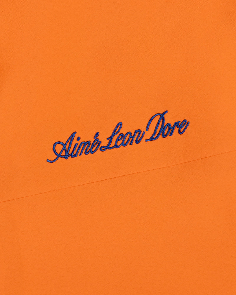 Orange Mets GORE-TEX Rain Delay Jacket with Aimé Leon Dore embroidered in blue script near the center.