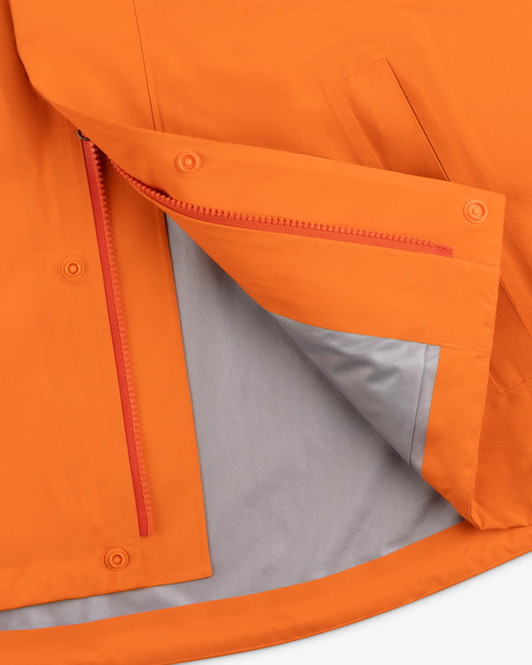 Close-up of the Mets GORE-TEX Rain Delay Jacket’s open flap, revealing a red zipper and gray lining inside.