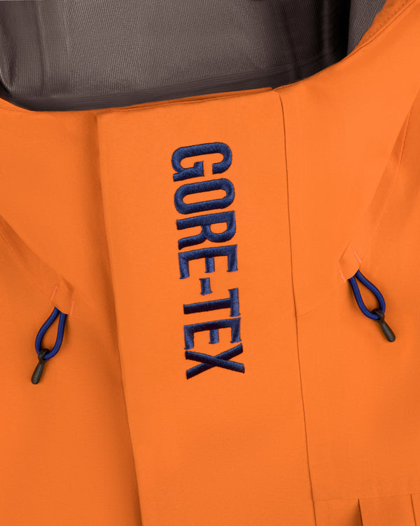 Close-up of a Mets GORE-TEX Rain Delay Jacket with blue GORE-TEX embroidery on the front flap.