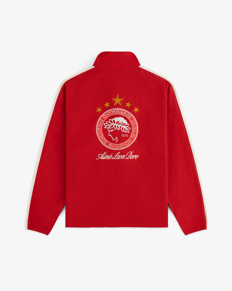 Red ALD / Olympiacos F.C. Nylon Quarter Zip Pullover with a white stripe down the sleeves and a soccer crest on the back.