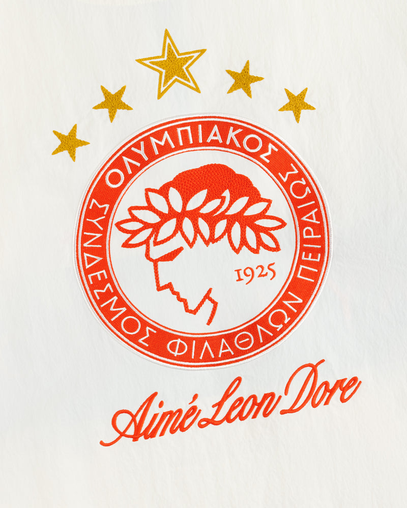 ALD / Olympiacos F.C. Nylon Quarter Zip Pullover featuring a circular logo with five gold stars and Aimé Leon Dore text.