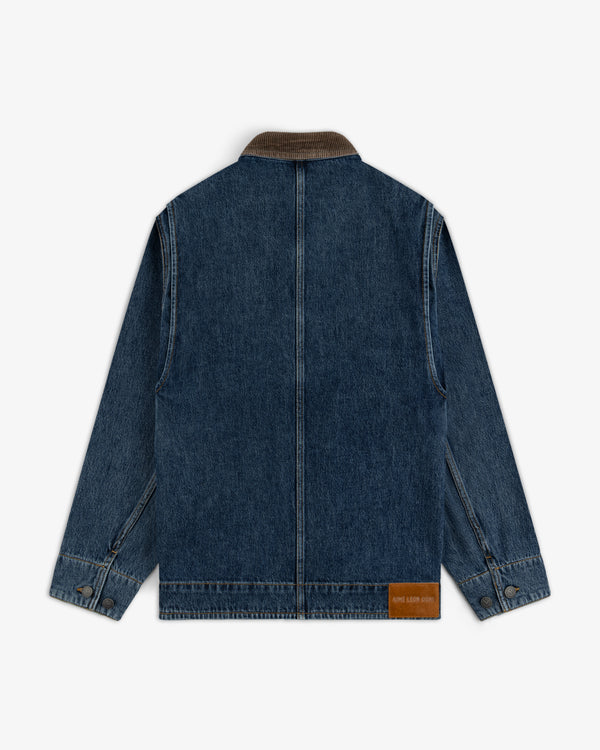 Back view of a Denim Chore Coat in blue denim with a brown corduroy collar and a leather brand patch at the hem.