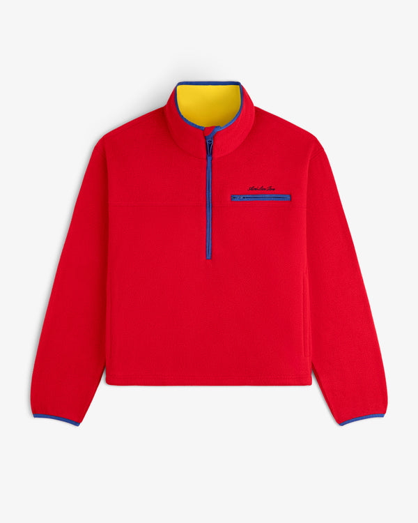 Script Fleece Half Zip Pullover in red fleece with a yellow inner collar and blue trim.