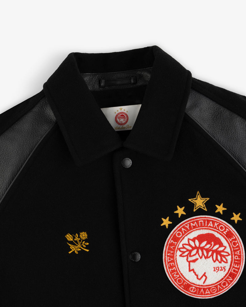 ALD / Olympiacos F.C. Team Leather Jacket with black sleeves, an embroidered rose, and a circular team crest.
