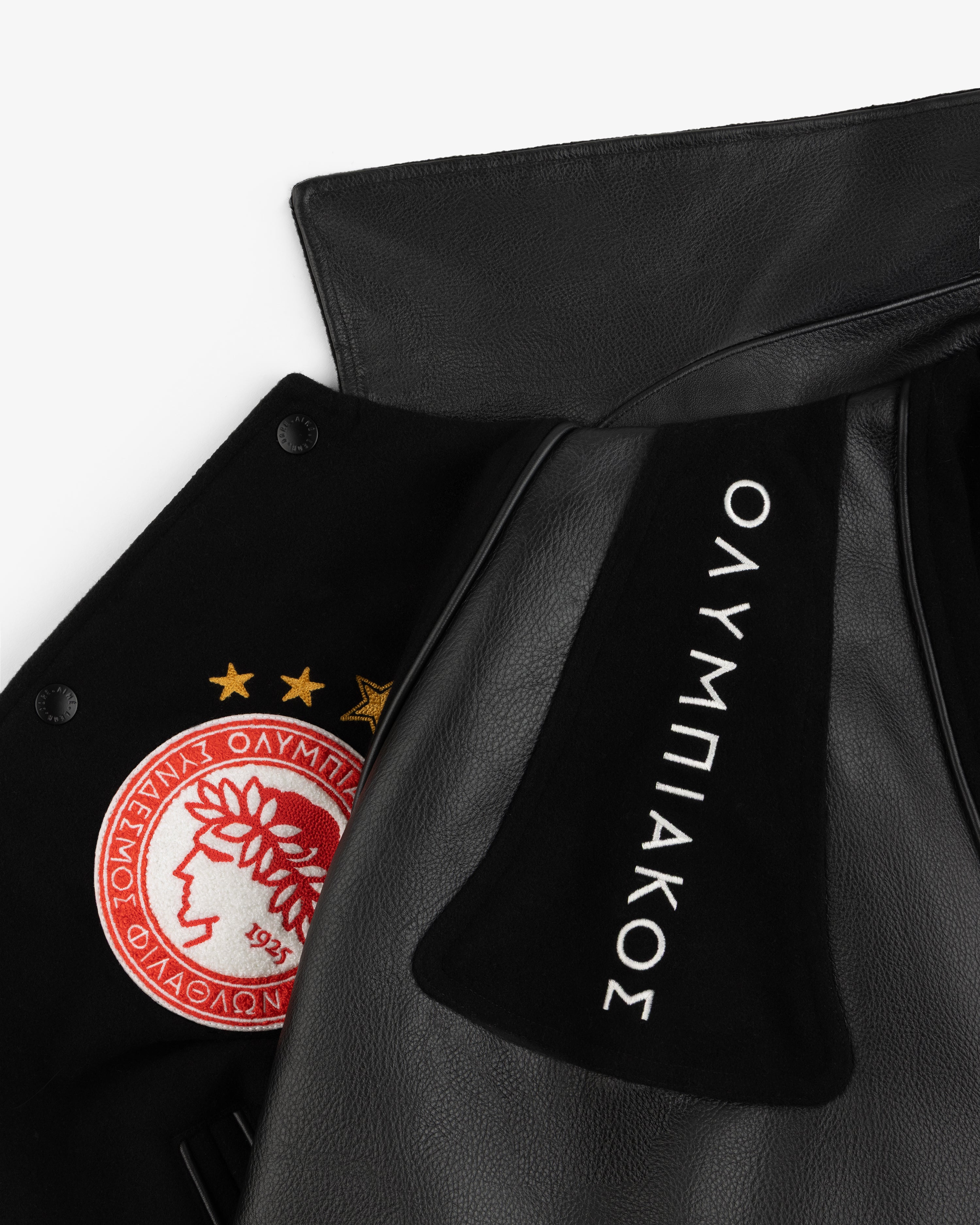 ALD / Olympiacos F.C. Team Leather Jacket featuring a red and white crest, three gold stars, and Greek embroidery.