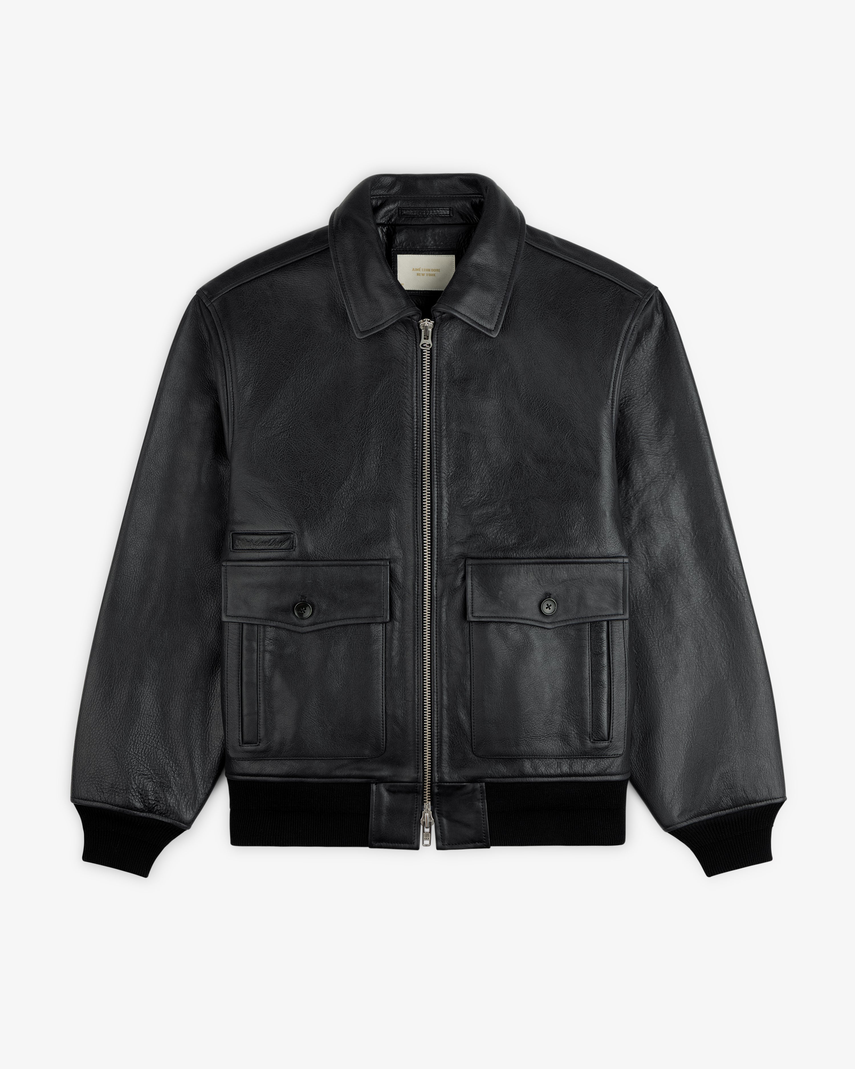 Napa Leather Bomber Jacket in black featuring a front zipper, two buttoned pockets, and ribbed cuffs.