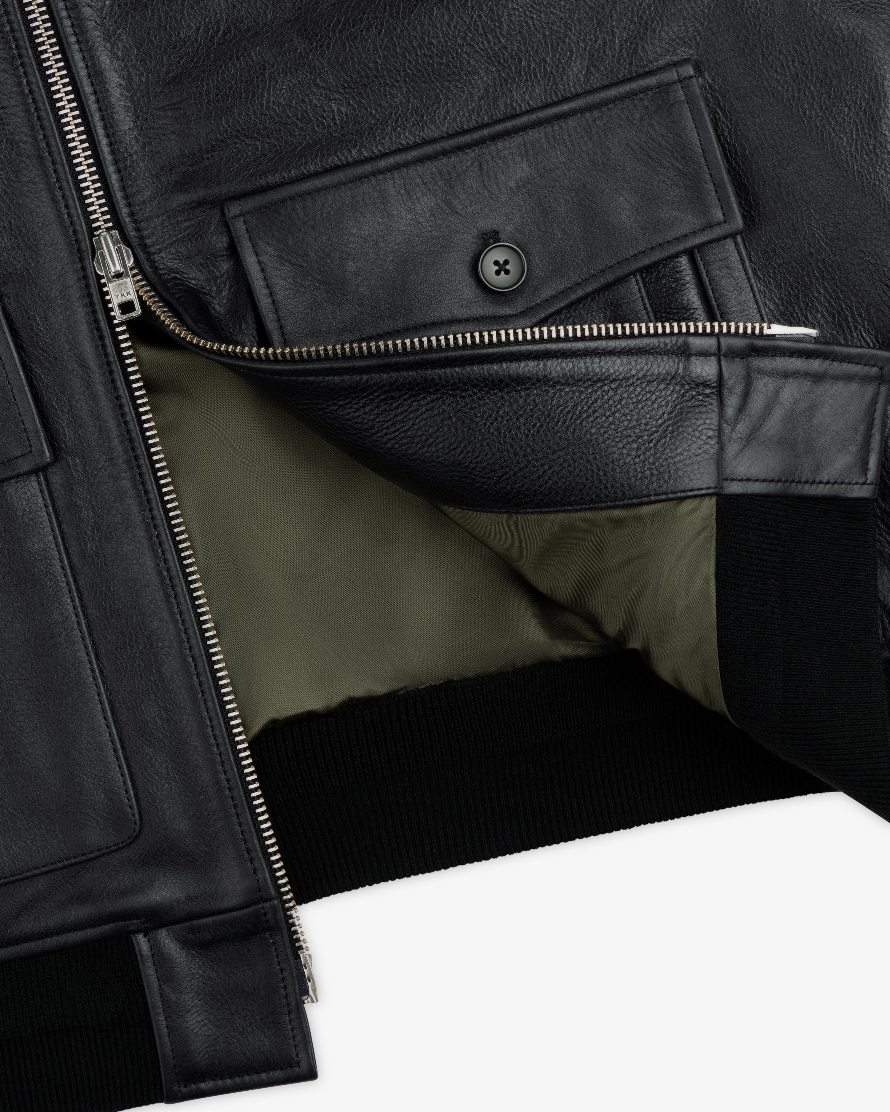 Napa Leather Bomber Jacket in black with a silver front zipper, buttoned chest pocket, and olive green lining.