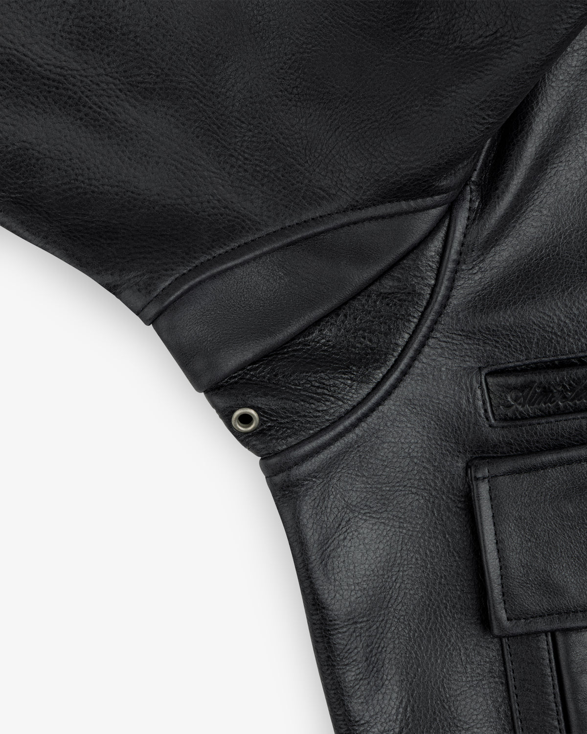 Close-up of a Napa Leather Bomber Jacket underarm featuring a metal grommet vent and a small pocket.
