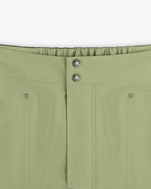 Close-up of ALD/The North Face GORE-TEX Pant featuring front seam, two metal buttons, and elastic waistband at back.