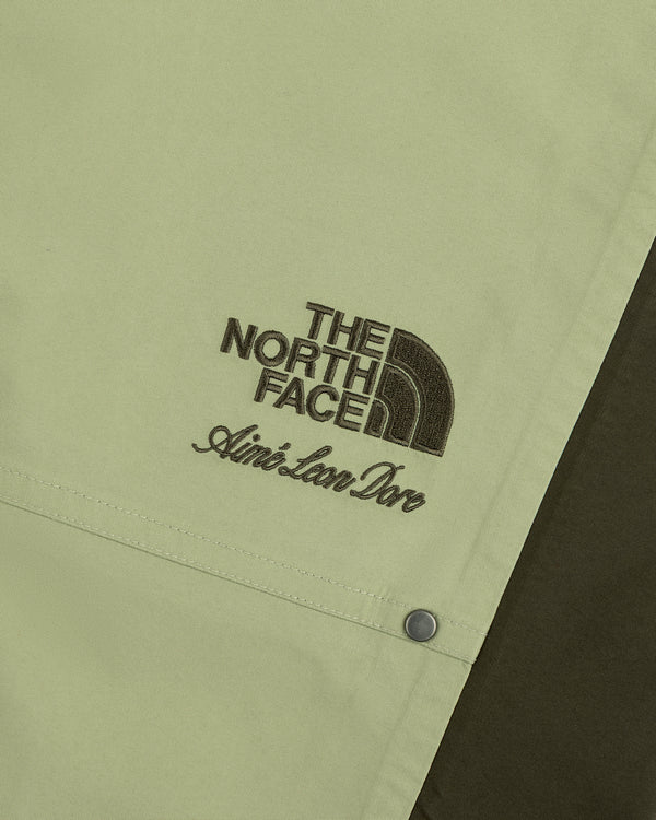 Close-up of ALD / The North Face GORE-TEX Pant with embroidered logos in brown thread.