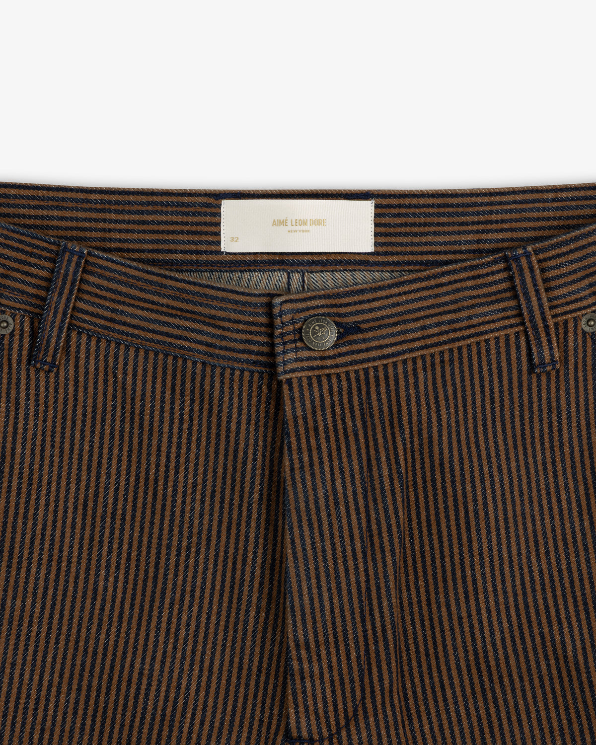 Hickory Stripe Painter Pant in brown and navy with belt loops, visible button, and white waistband label.