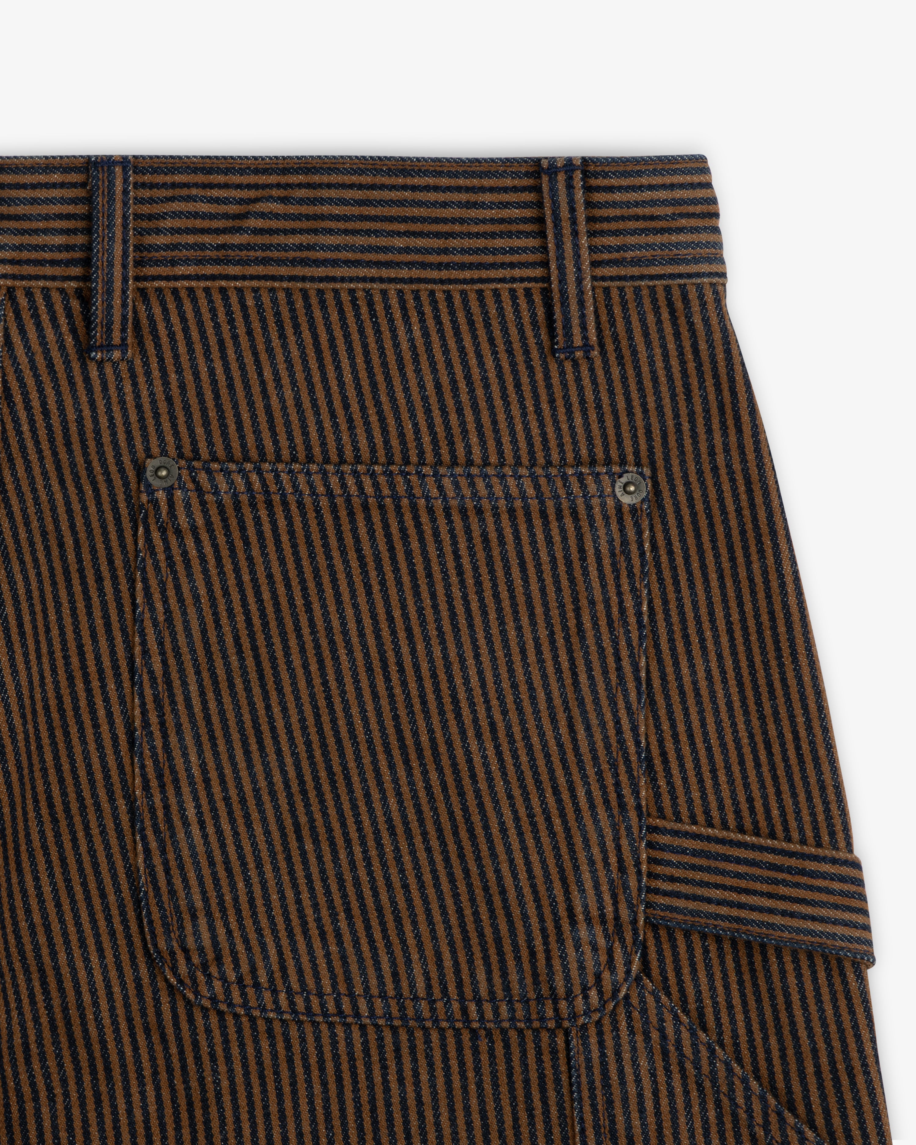 Close-up of Hickory Stripe Painter Pant pocket with belt loops and metal rivets on a white background.