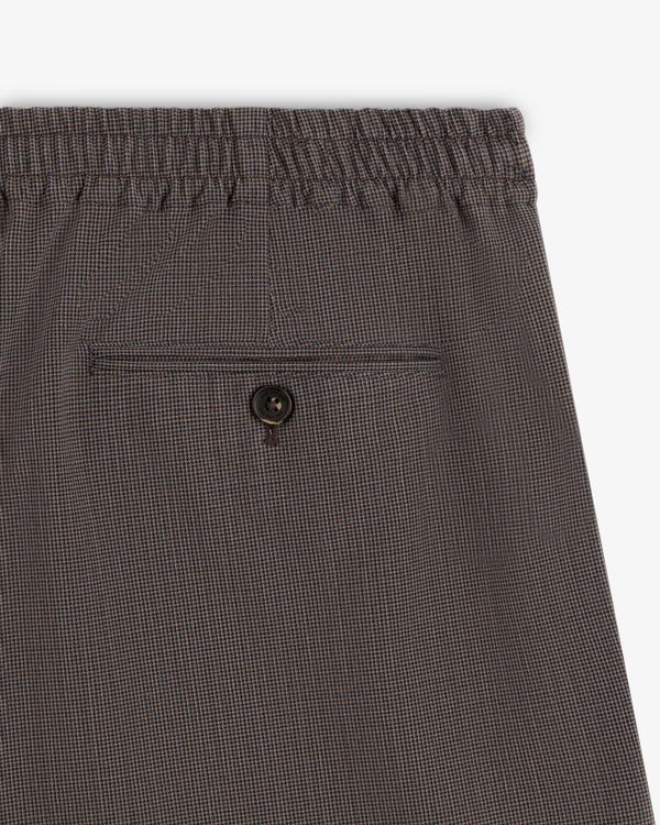 Close-up of Houndstooth Elasticated Waist Trouser with back button pocket and comfy waistband.