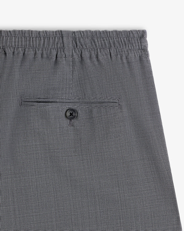 Houndstooth Elasticated Waist Trouser with single back pocket and black button.