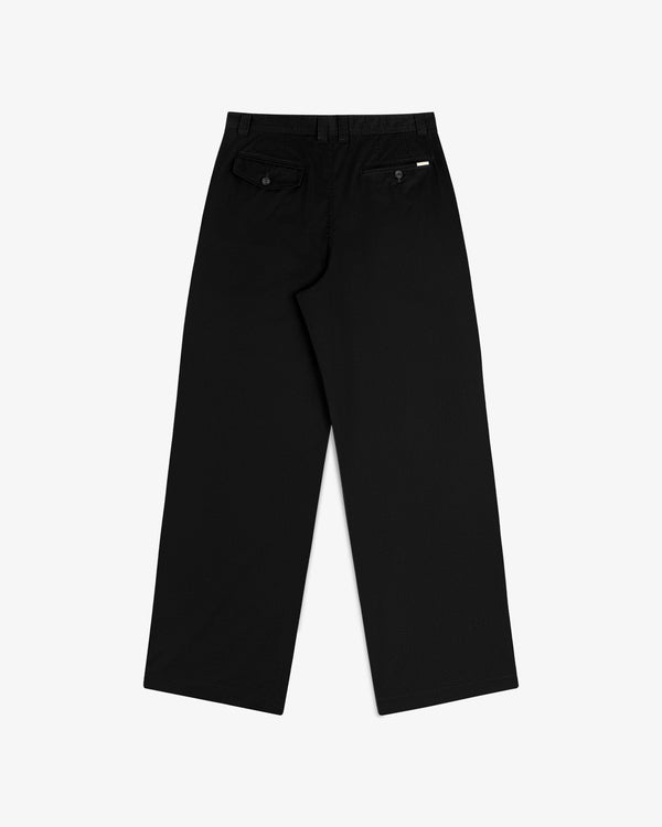 Double Pleated Officer Pant in black, wide-leg, back view with two buttoned pockets and a white label above right pocket.