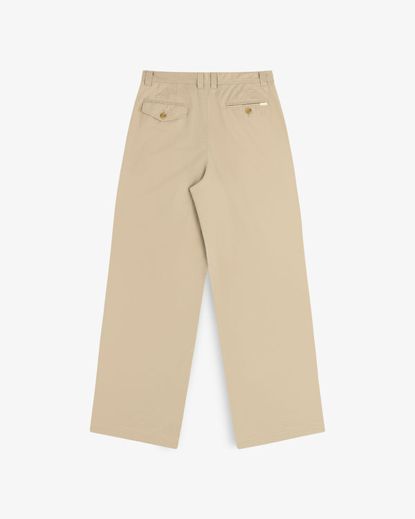 Double Pleated Officer Pant in tan, wide-leg, rear view with two buttoned pockets and a white tag above the right pocket.