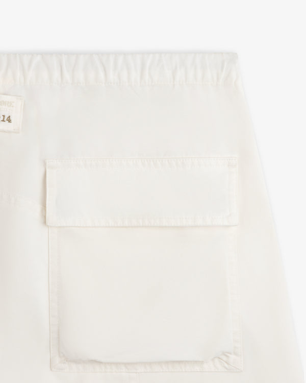 Garment Washed Aviator Pants in off-white with an elastic waistband and a large patch pocket on the leg.