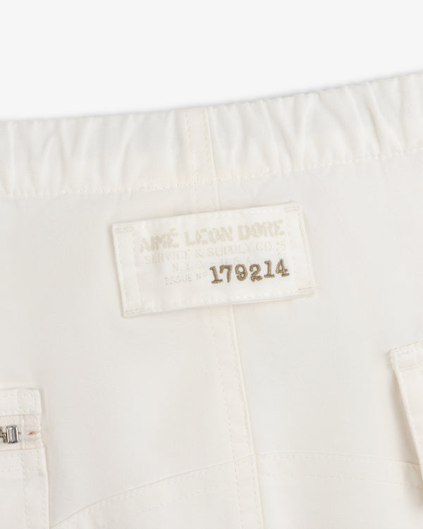 Off-white Garment Washed Aviator Pant featuring a rectangular patch with Aimé Leon Dore Service & Supply Co. Issue No 179214.