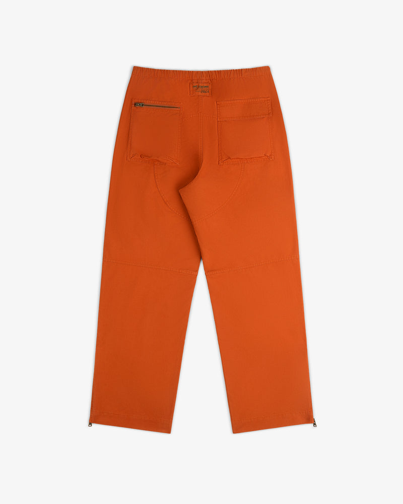 Back view of orange Garment Washed Aviator Pant featuring two back pockets, one zippered, and zippered ankle cuffs.