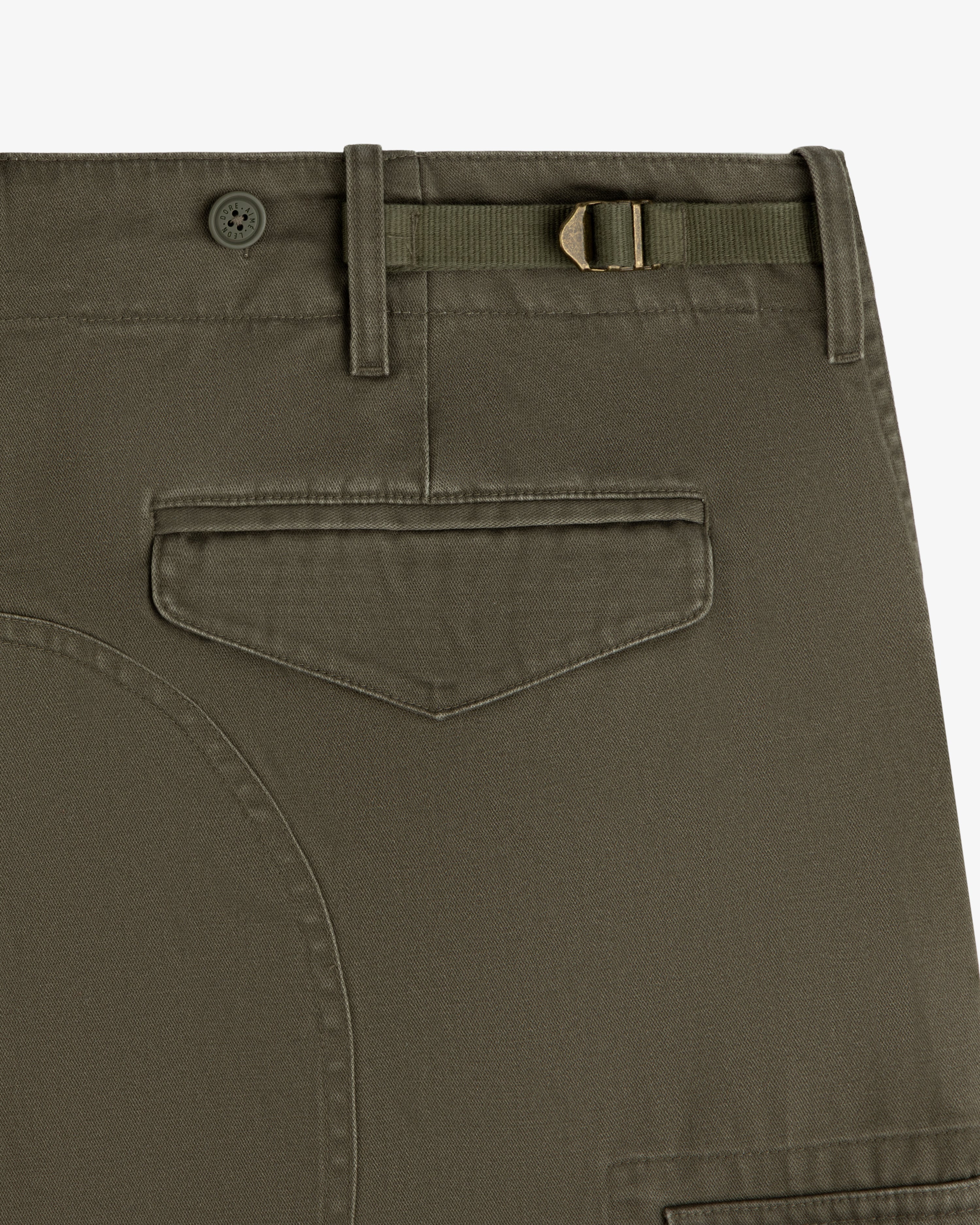 Close-up of Fatigue Pant in olive green with buttoned belt loop, side tab, and flap back pocket.