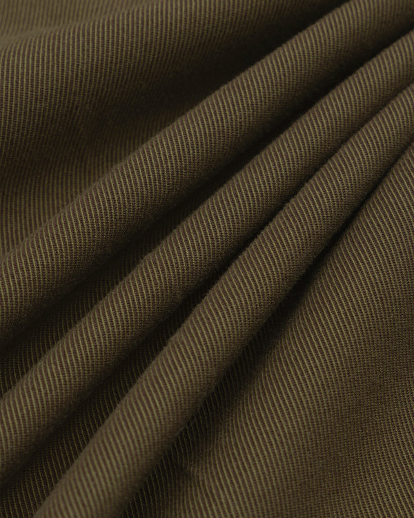 Close-up of olive green Wool Blend Suit Trouser fabric with a diagonal twill weave and soft folds.