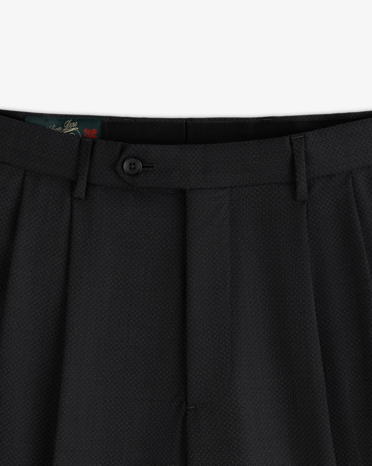 Close-up of the waistband and button closure of black Double Pleated Wool Jacquard Suit Trouser.
