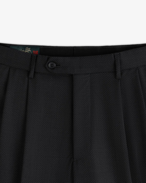 Close-up of the waistband and button closure of black Double Pleated Wool Jacquard Suit Trouser.