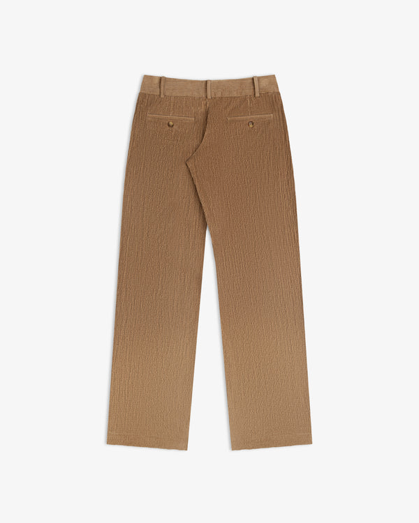 Back view of tan Double Pleated Corduroy Trouser with two buttoned welt pockets.
