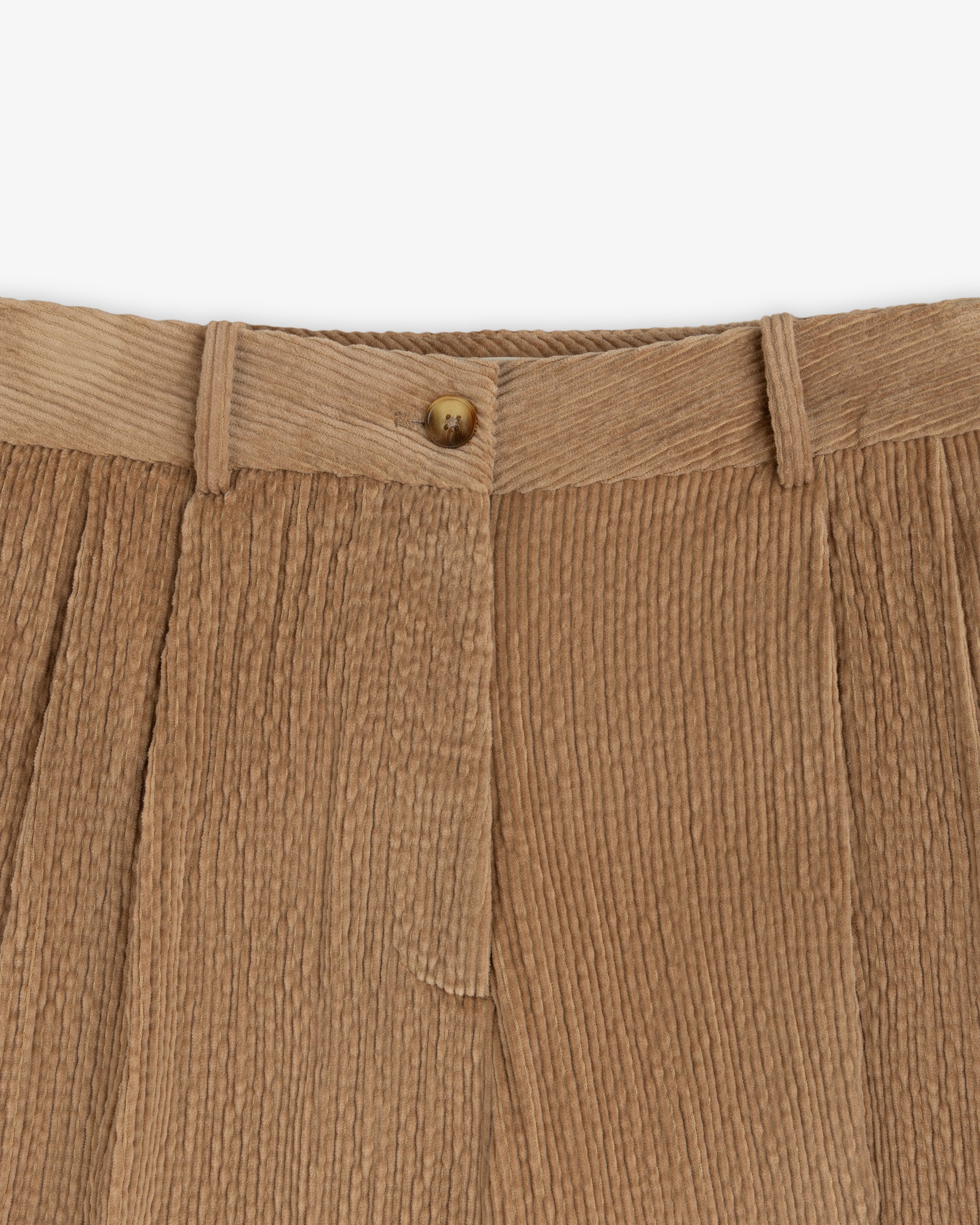 Double Pleated Corduroy Trouser in tan with a front button closure and double pleats.