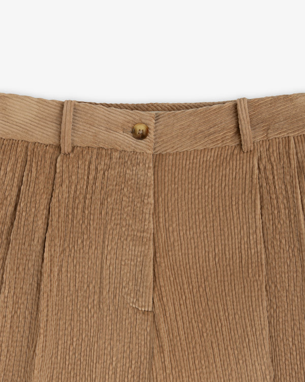 Double Pleated Corduroy Trouser in tan with a front button closure and double pleats.
