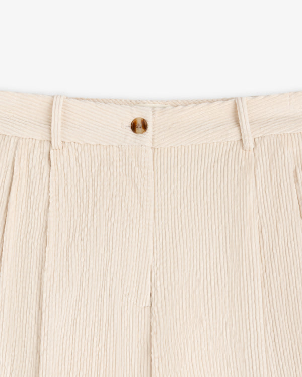 Off-white Double Pleated Corduroy Trousers with a single button closure at the waist.