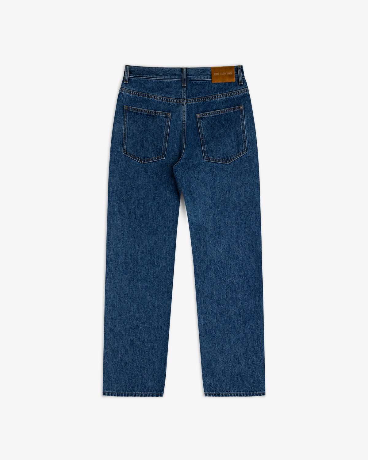Back view of ALD Relaxed Fit Denim in dark wash blue, featuring two back pockets and a leather logo patch on the waistband.