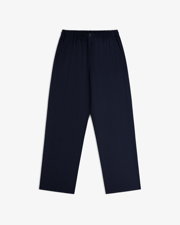 Wool Chalk Stripe Elasticated Waist Trouser in dark navy blue pinstripe with an elasticated waistband and button fly.