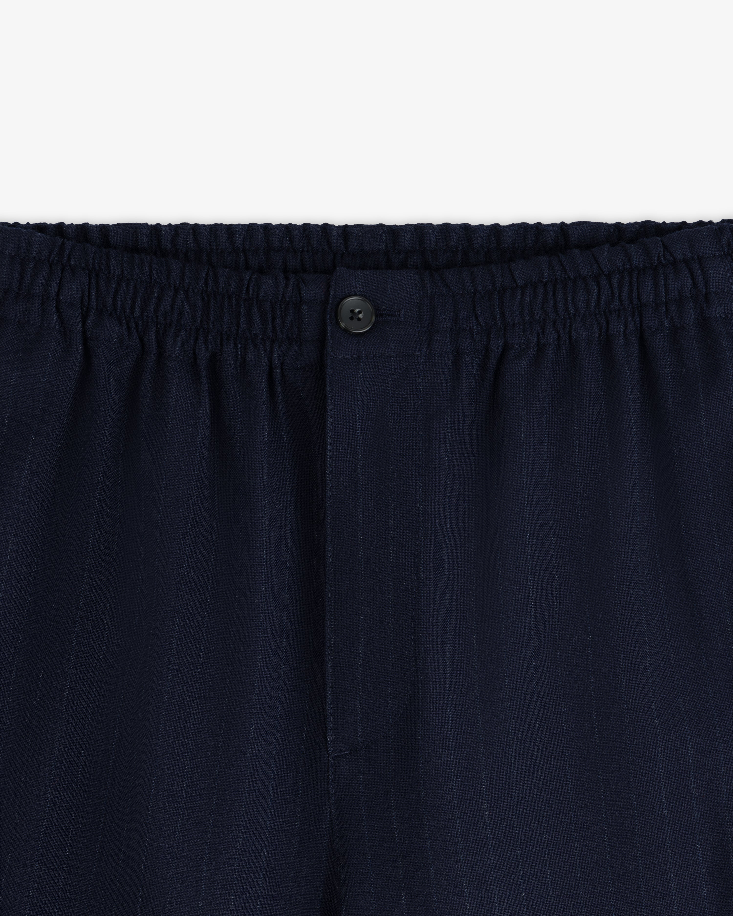 Wool Chalk Stripe Elasticated Waist Trouser in dark blue with an elasticated waistband and a single button fly.