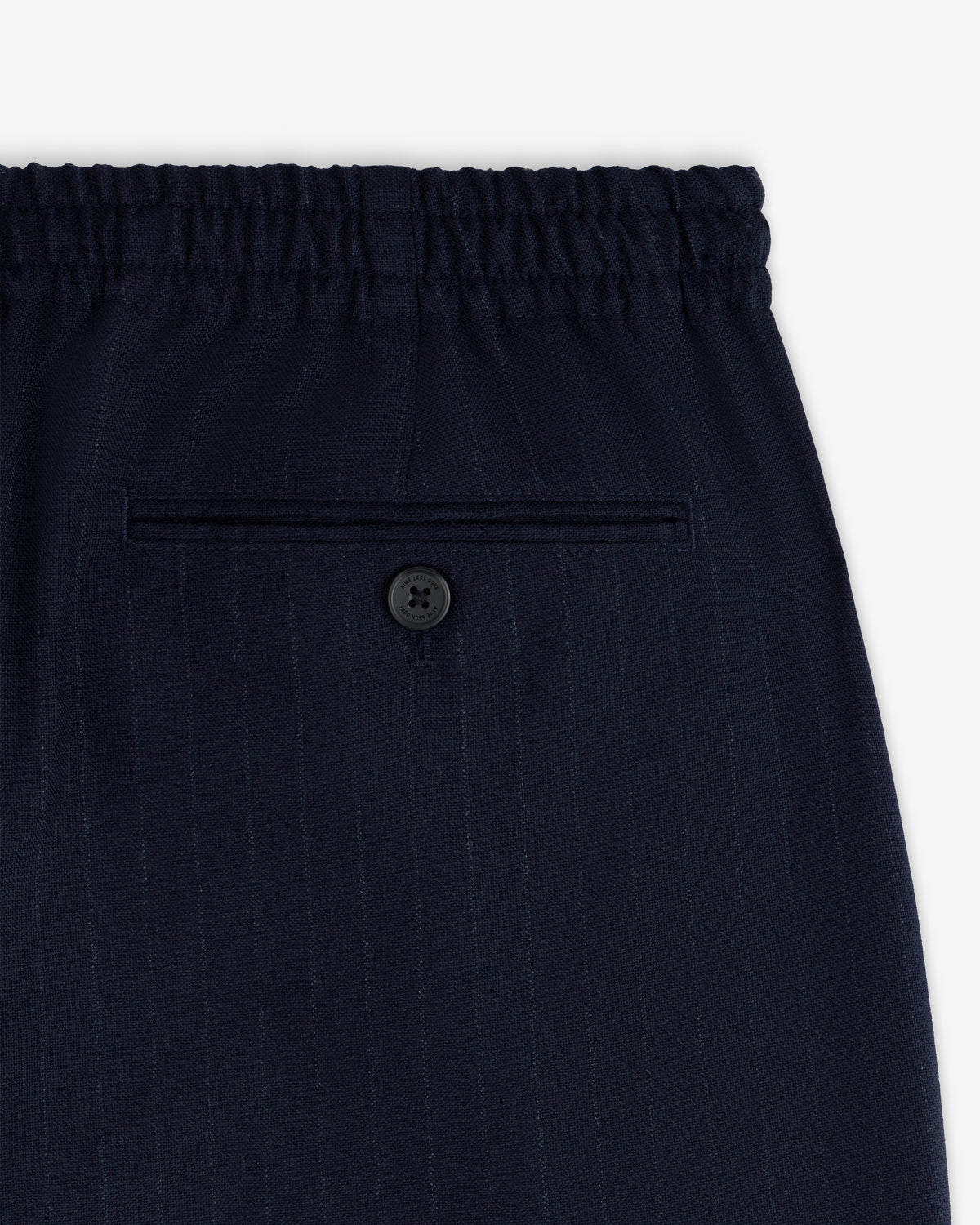 Wool Chalk Stripe Elasticated Waist Trousers in dark blue with an elasticated waistband and a single buttoned back pocket.