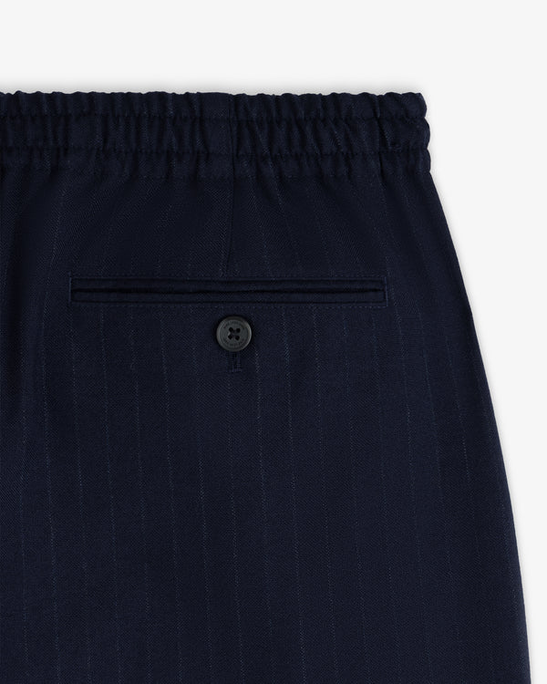 Wool Chalk Stripe Elasticated Waist Trousers in dark blue with an elasticated waistband and a single buttoned back pocket.