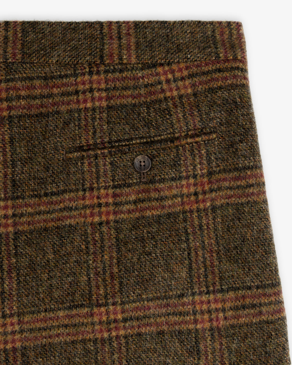 Plaid Tweed Suit Trouser in olive green, black, and red wool with a buttoned back pocket.