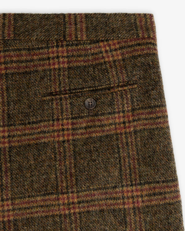 Plaid Tweed Suit Trouser in olive green, black, and red wool with a buttoned back pocket.
