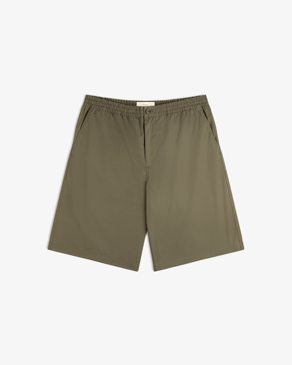 Cotton Casual Short in olive green with elastic waistband, side pockets, and flat front, shown on a white background.