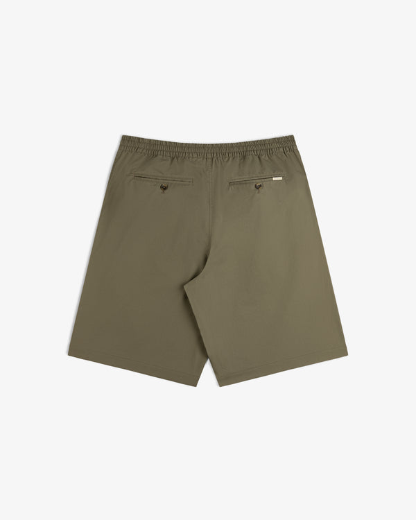 Back view of Cotton Casual Short in olive green with elastic waist, two buttoned back pockets, on white background.