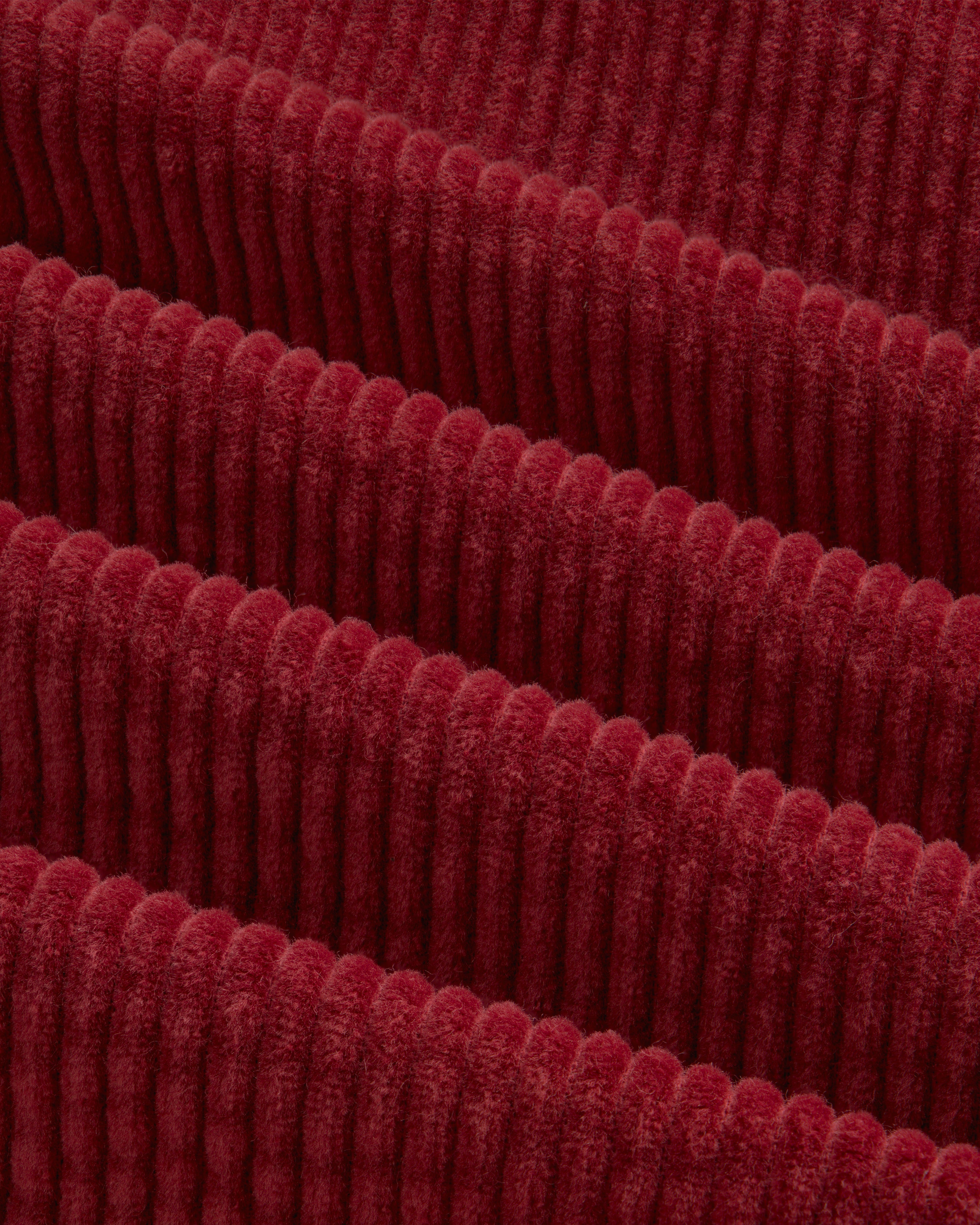 Deep red Corduroy Leon Overshirt fabric with thick, vertical ridges.