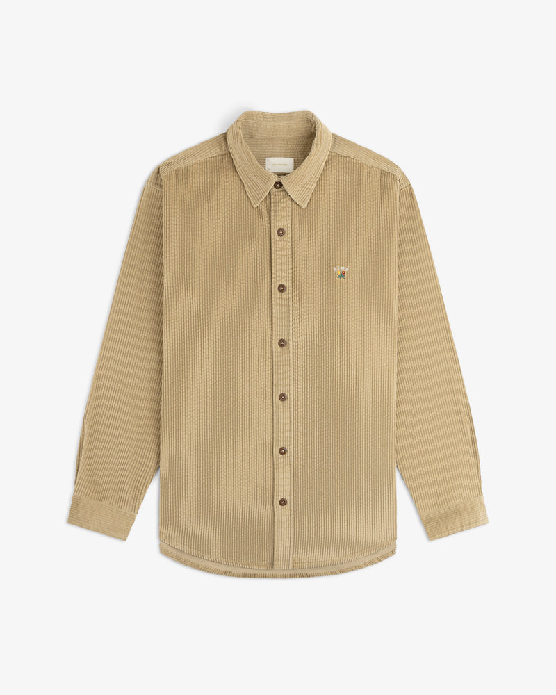 Tan long-sleeve Corduroy Leon Overshirt with a small embroidered graphic on the chest.