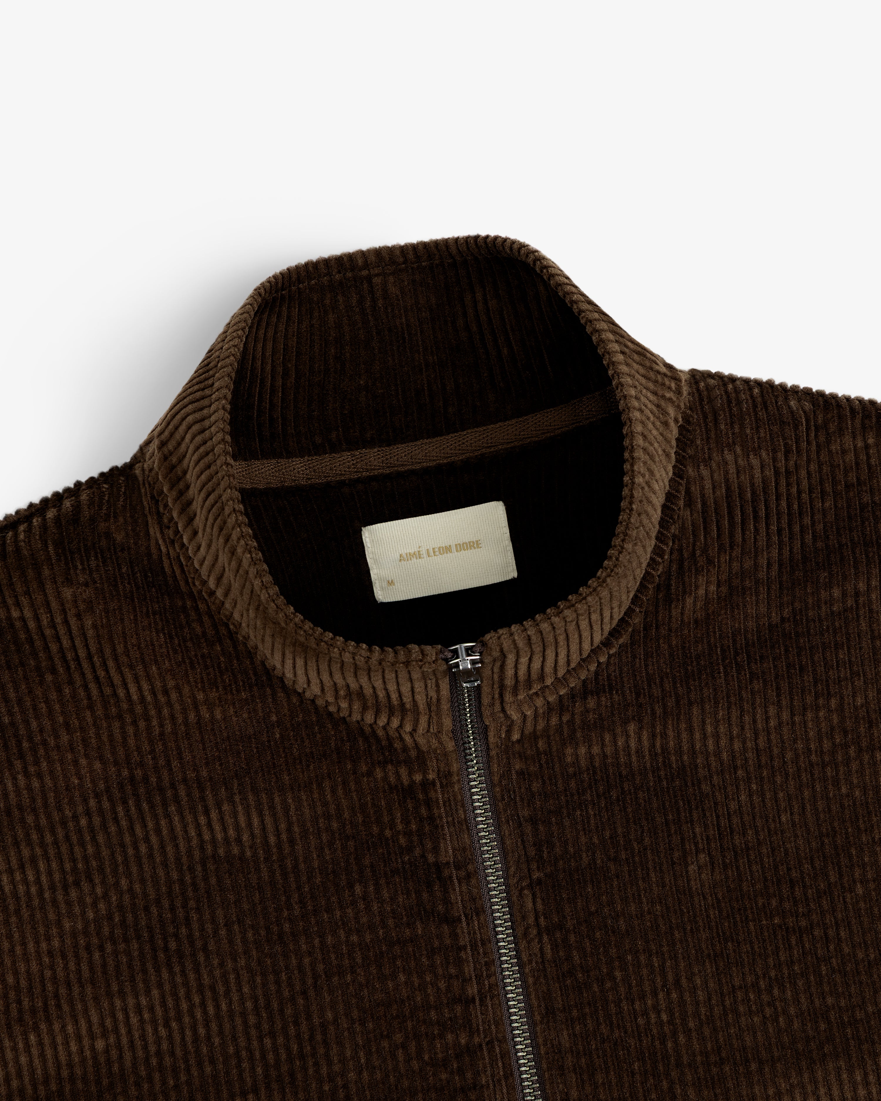 Brown Quarter Zip Corduroy Shirt with a high neck and front zipper.