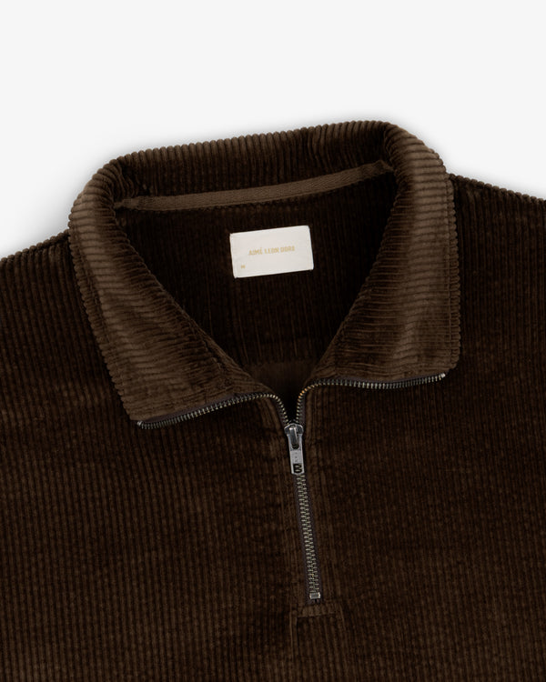 Dark brown Quarter Zip Corduroy Shirt featuring a metal zipper and a brand label at the collar.