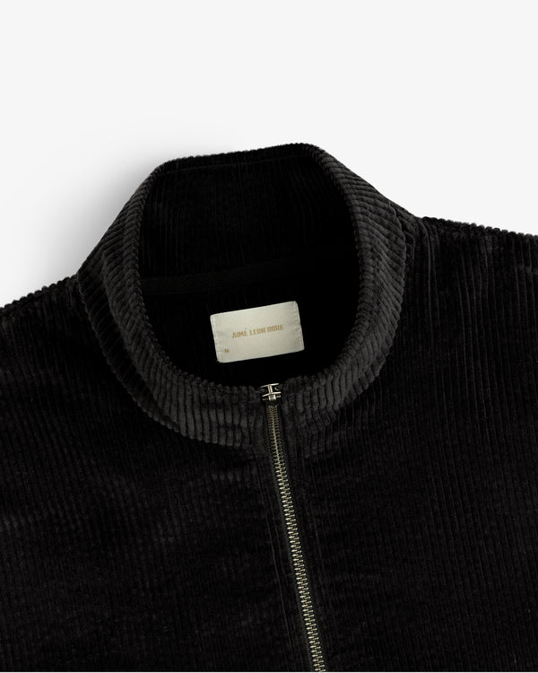 Black Quarter Zip Corduroy Shirt with a silver zipper and an interior neck label.