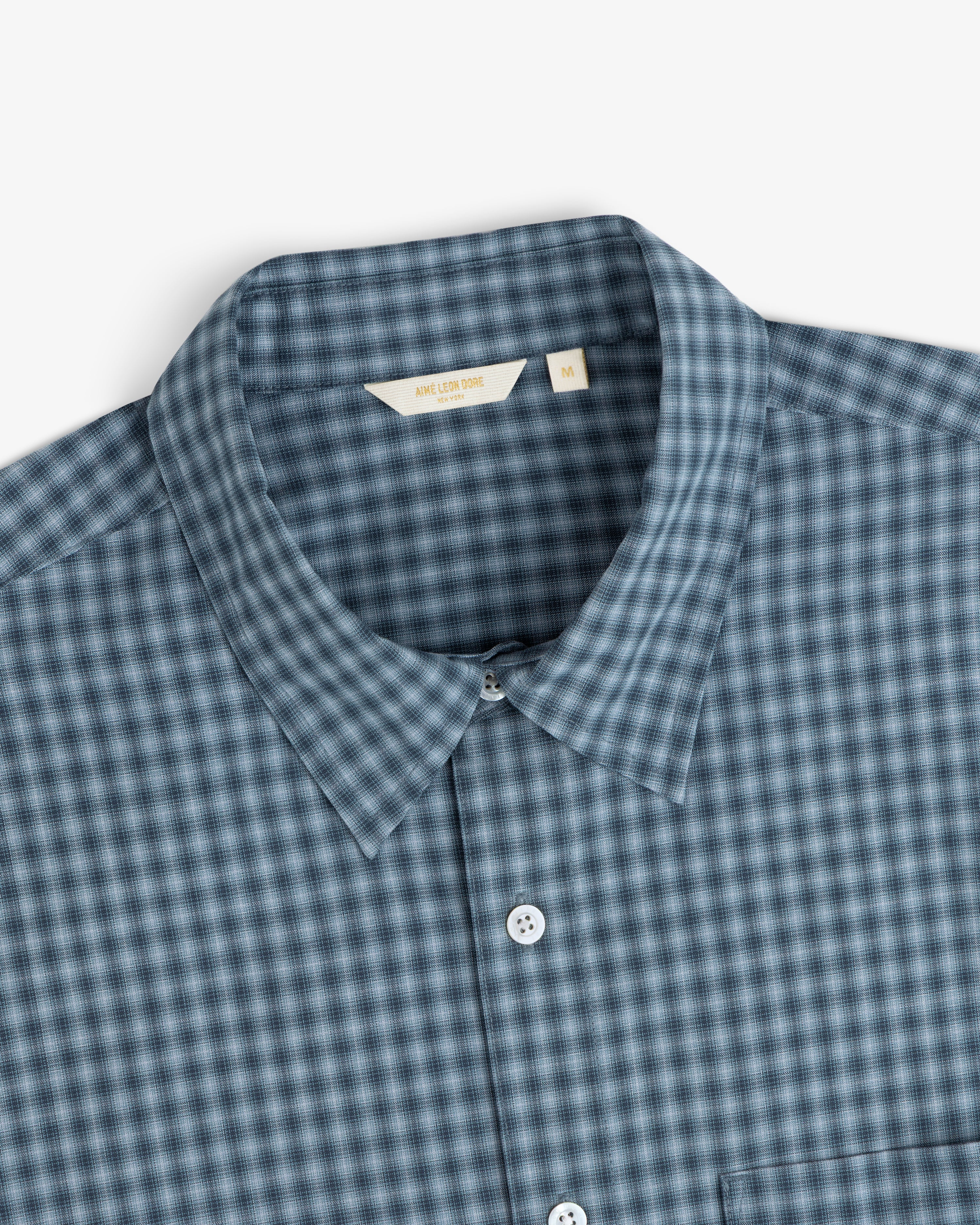 Plaid Casual Shirt with a collar in blue and black checks, pictured on a white background.