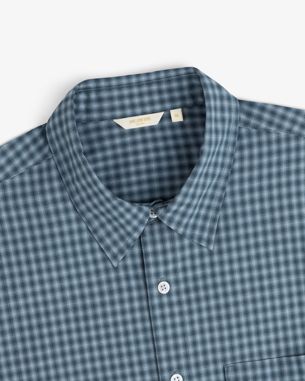 Plaid Casual Shirt with a collar in blue and black checks, pictured on a white background.