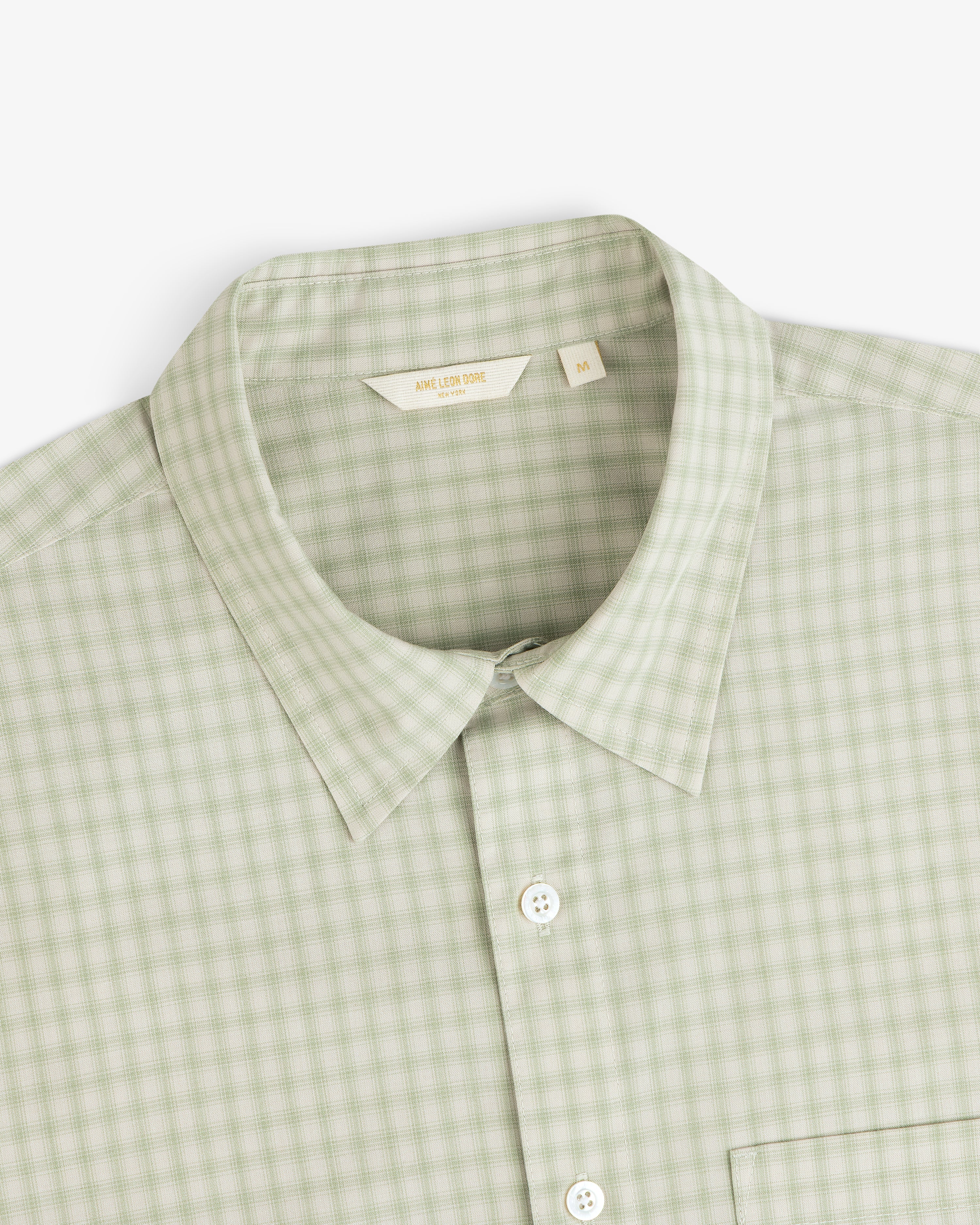 Plaid Casual Shirt in light green, size M, features a collar and button-up style. Shown from above.