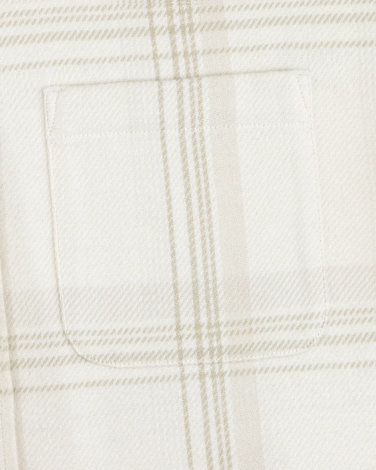 Close-up of a chest pocket on the Yarn Dyed Plaid Overshirt in white and beige.